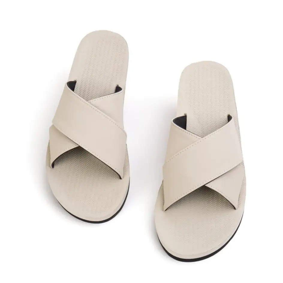 Exquisite custom cross flip flops, blending sophistication and comfort for a chic summer outing or leisurely stroll.