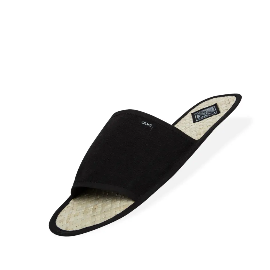 Cozy flip flop-style slippers designed for indoor use, offering comfort and a laid-back vibe for your home.