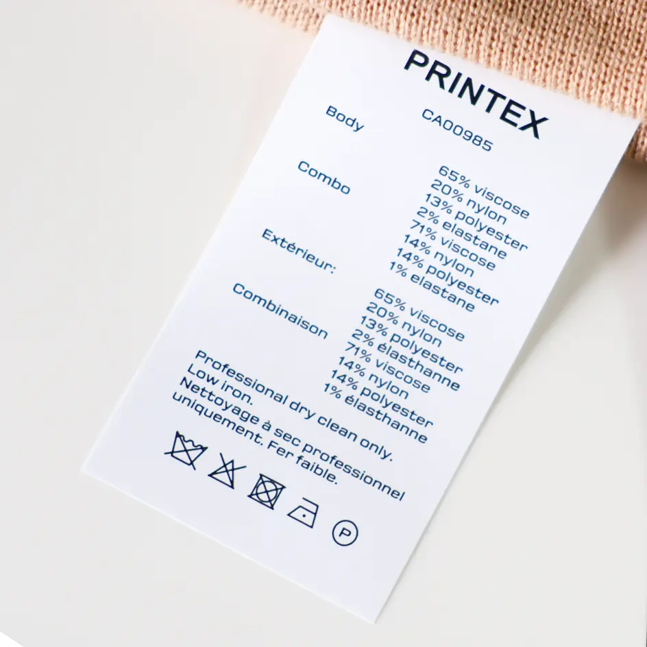 Custom care labels utilizing strong base material, offering reliable care instructions for clothing and textiles.