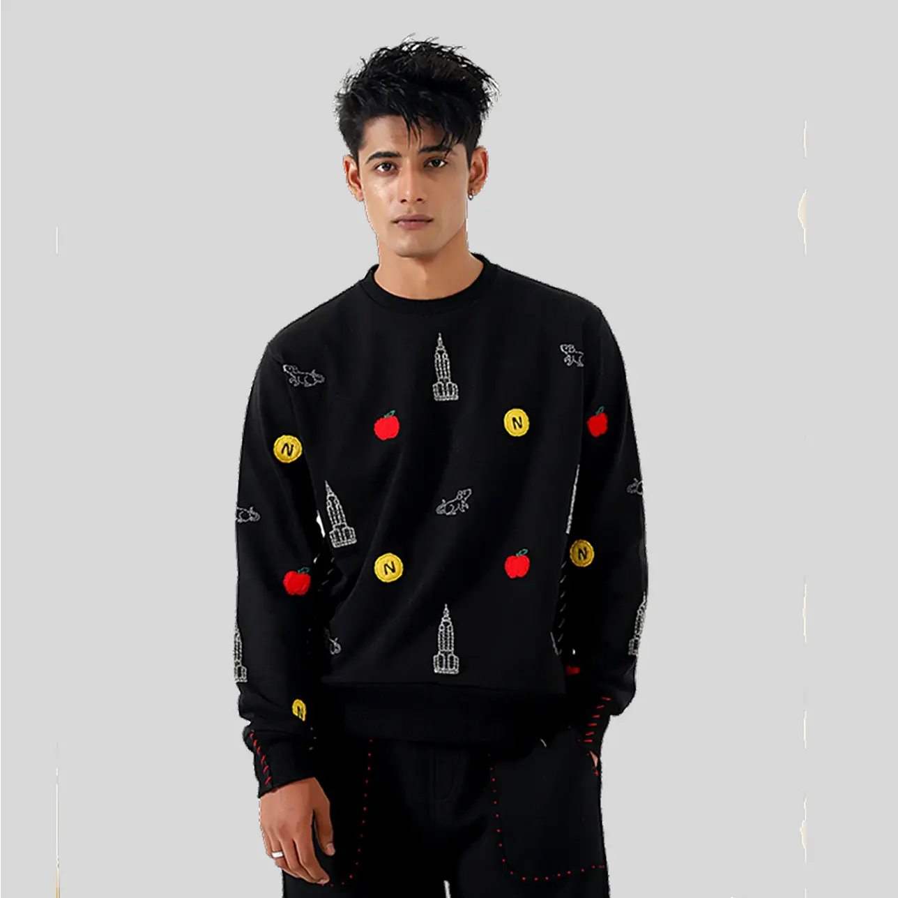 A sleek, well-fitted black sweatshirt featuring contemporary designs.