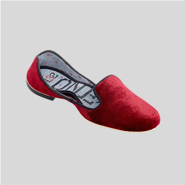 A set of cozy red wine elegant velvet slippers with a rich aesthetic finish.