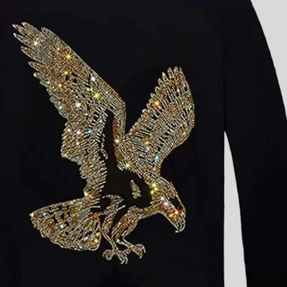 Sweatshirt design embellished with sparkling rhinestones, adding a touch of glam and shine.