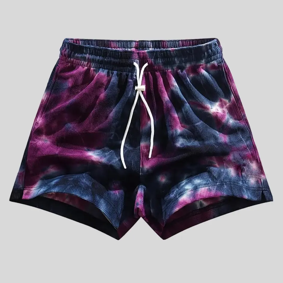 Bold and expressive tie-dye shorts with a swirl of vibrant colors, perfect for a laid-back, artistic style.