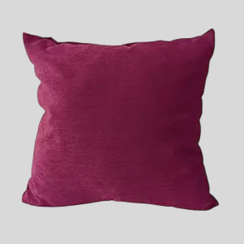 A luxurious wine-colored pillow with a deep, rich hue, adding elegance and warmth to any space.