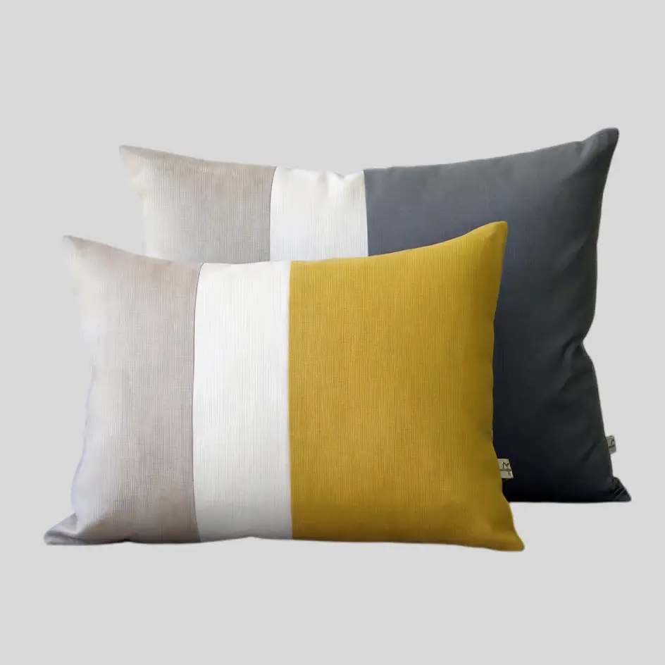 A sleek minimalist colors pillow in neutral and understated tones, ideal for a clean and contemporary interior style.