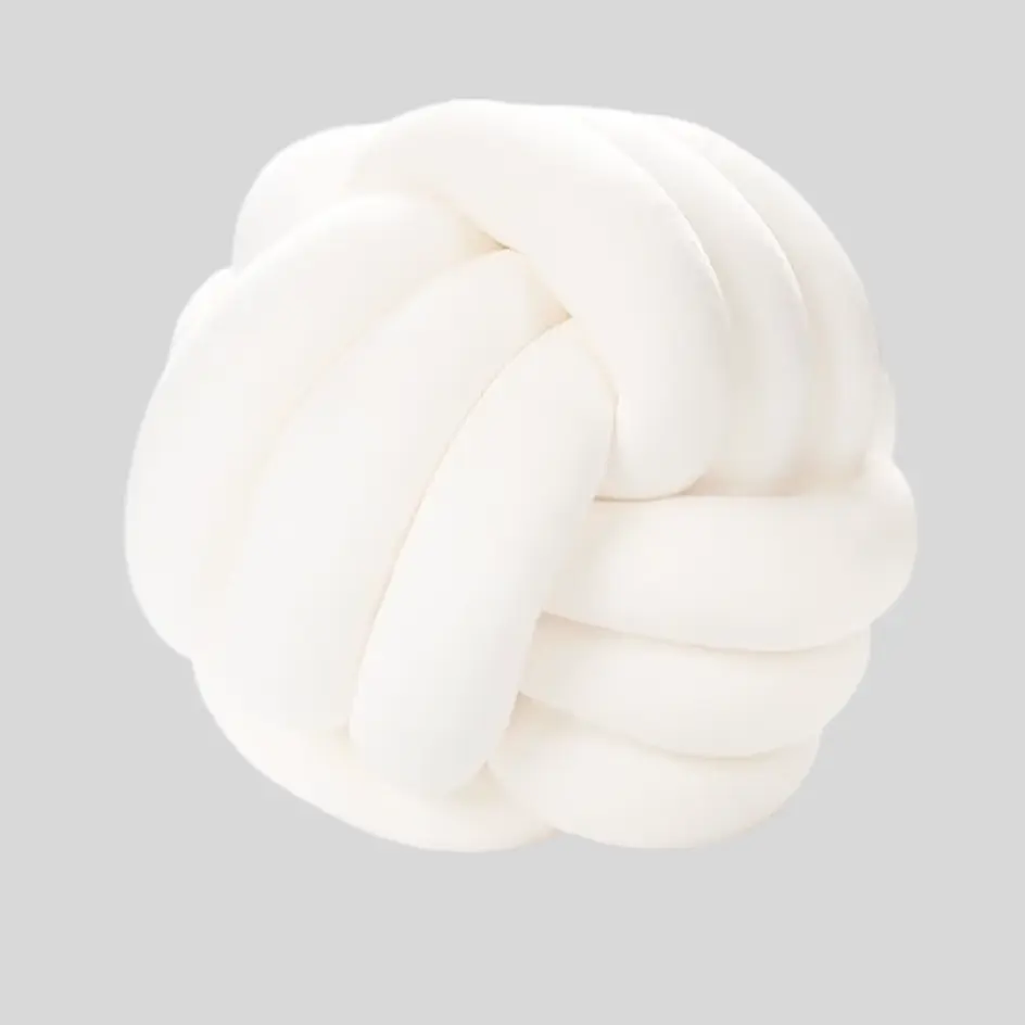 A trendy knot ball pillow with an intricate, intertwined design, perfect for modern and decorative aesthetics.