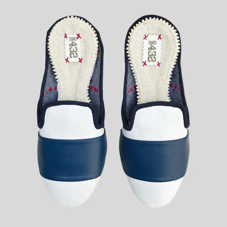 Leather slippers with custom color-blocked panels, combining contrasting shades for a bold and stylish design.