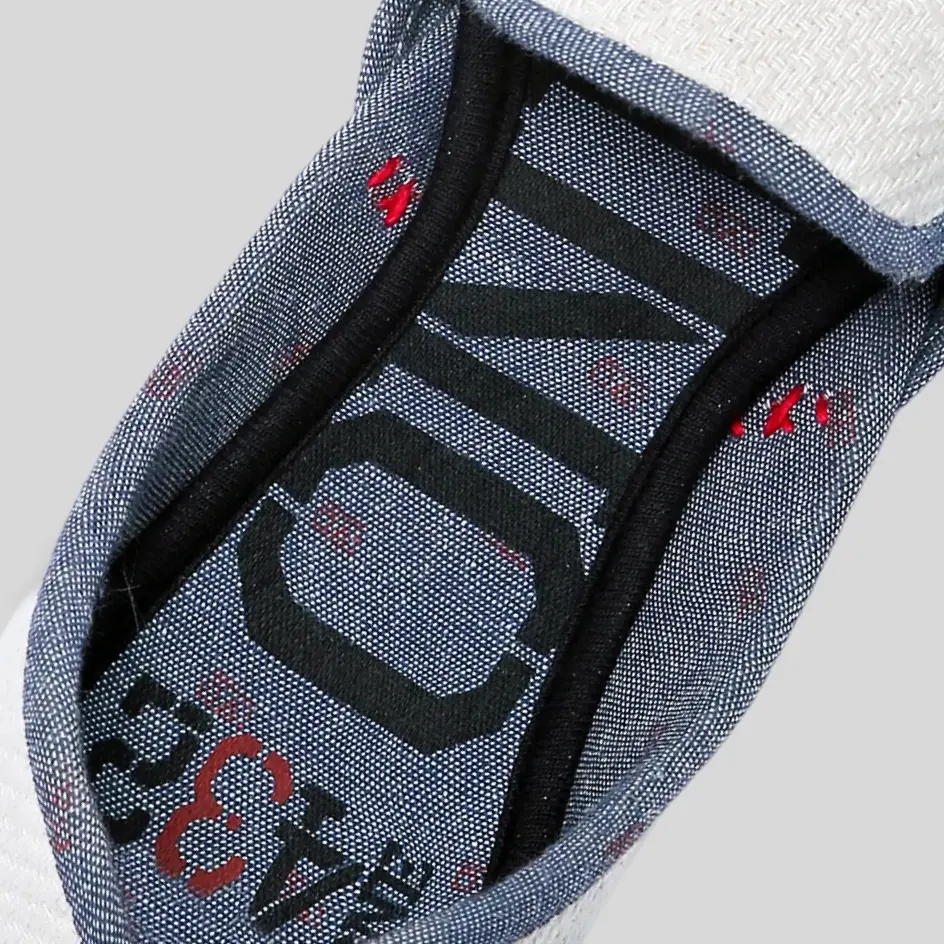 The interior of cotton slide slippers, revealing custom inside printing with branding details for a unique and personalized look.