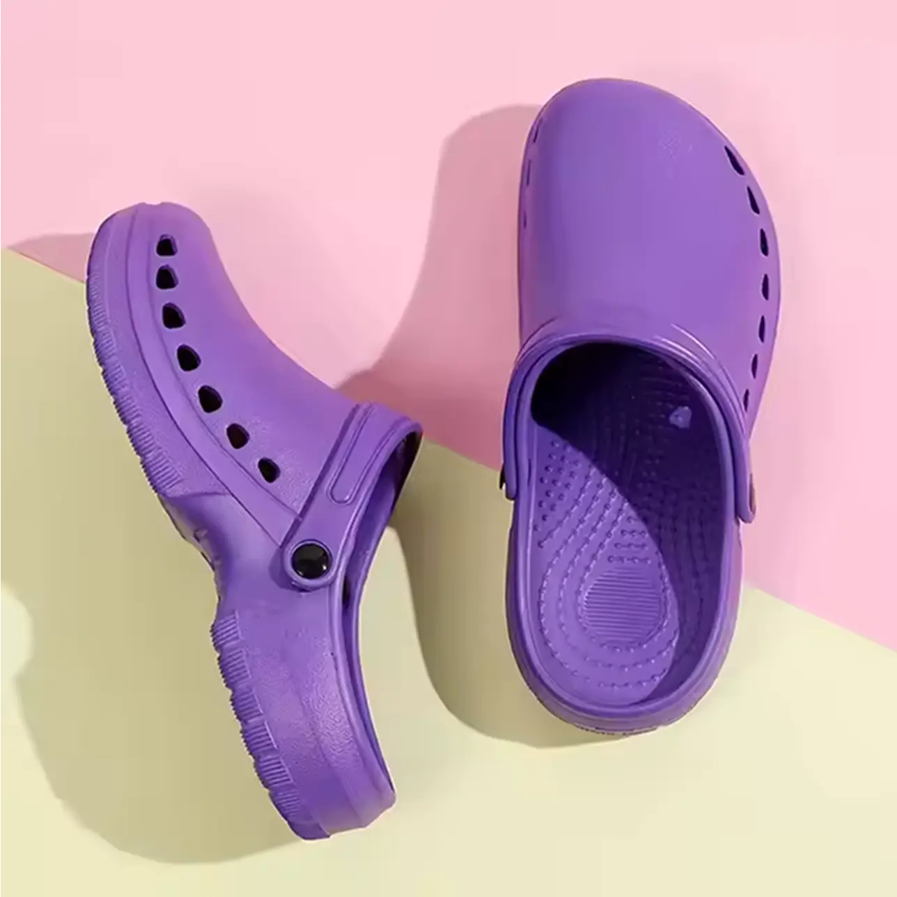 A pair of slip-resistant medical clogs, designed for all-day support and stability on hospital floors.