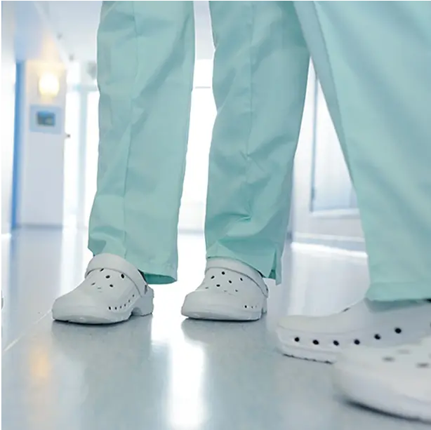 Breathable medical clogs with ventilation holes, keeping feet cool and fresh during extended shifts.