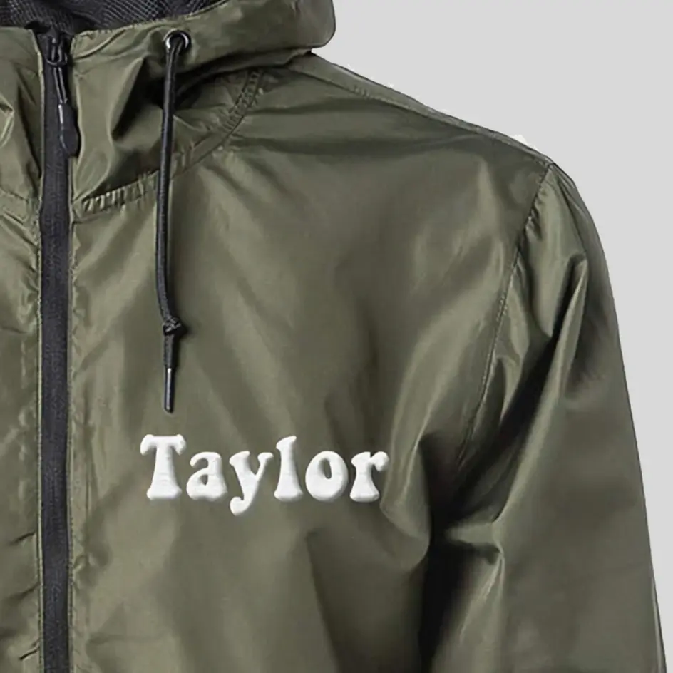 A waterproof jacket with embroidered branding, featuring high-quality stitched logos for a premium look.