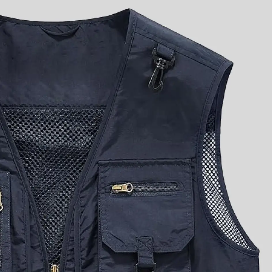 A nylon insulated fishing vest with a sturdy and water-resistant exterior, perfect for wet and windy fishing conditions.