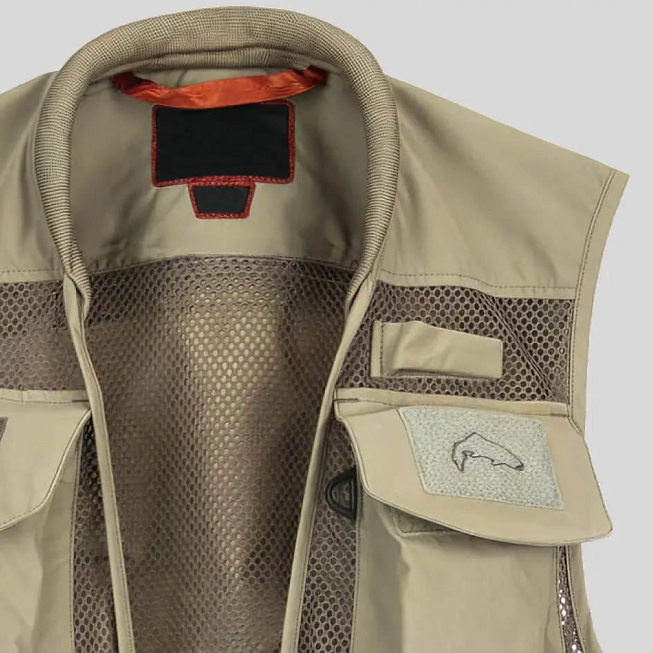 An insulated fishing vest featuring embroidery detailing, showcasing finely stitched branding for a premium look.