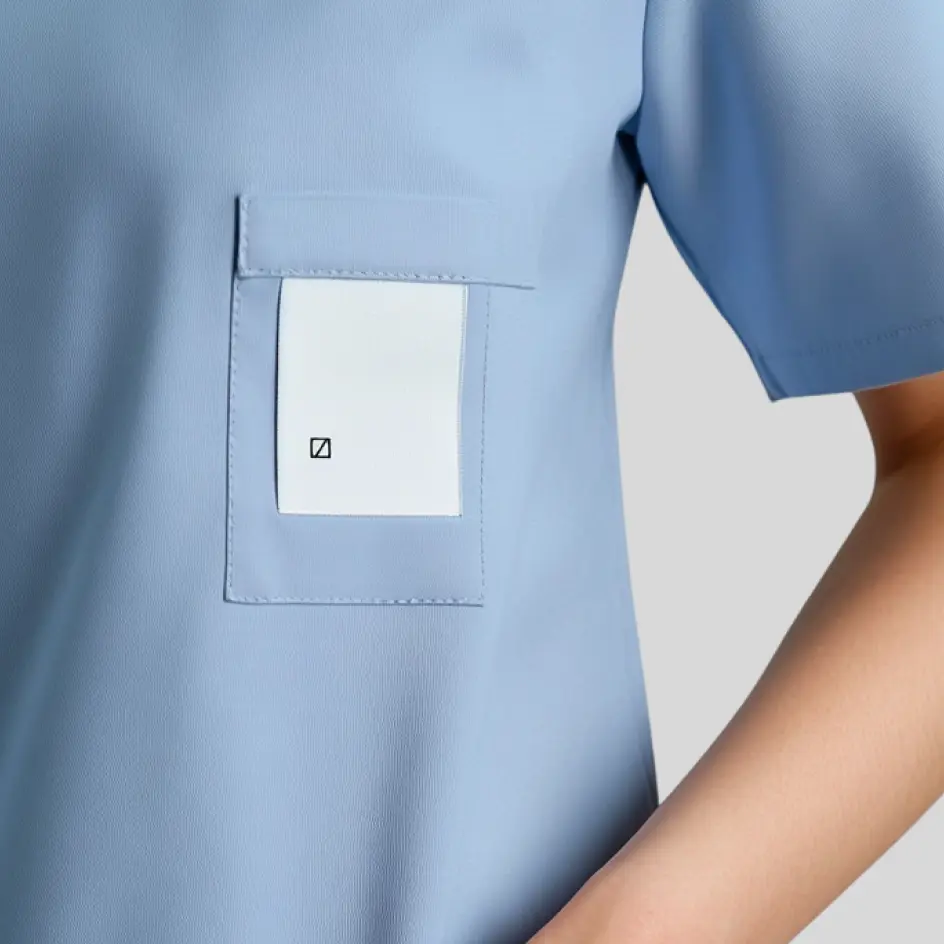 A scrub top with a discreet woven label, adding a premium touch to medical apparel.