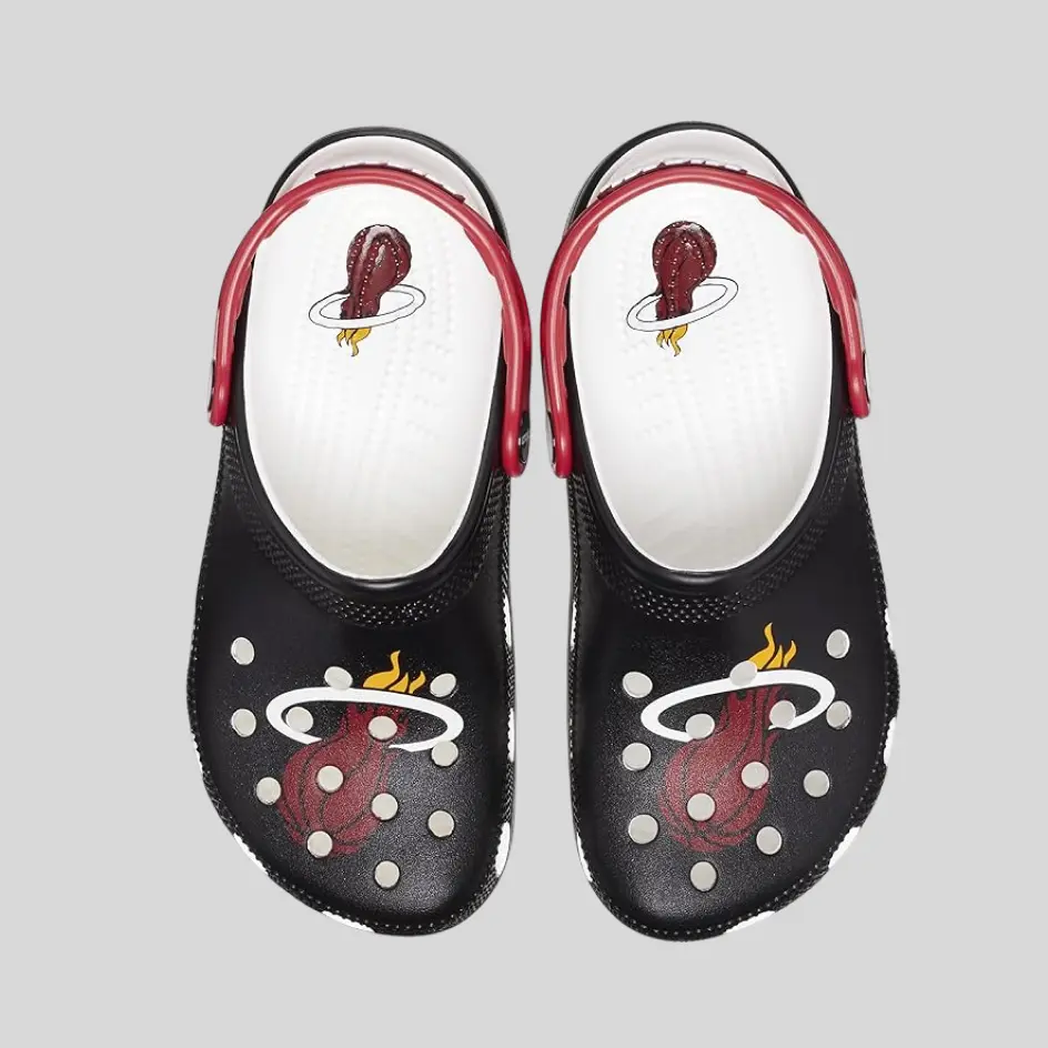 A pair of branded clogs featuring a custom logo for a personalized touch.