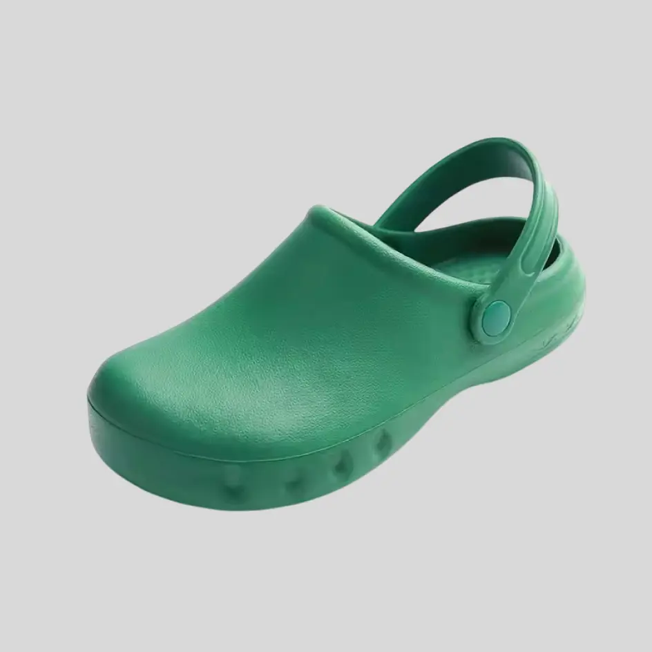 A pair of green medical shoes, designed with a refreshing and calming tone.