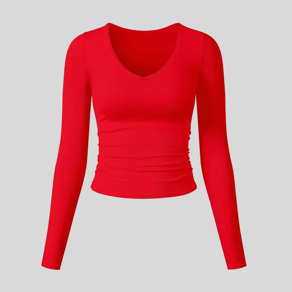 A red long sleeve yoga top, making a vibrant and powerful statement.