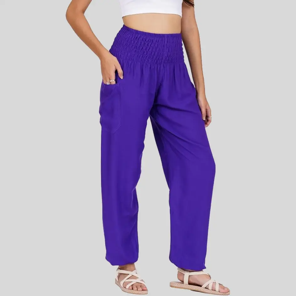 Harem pants in purple, bringing a stylish and playful touch to yoga outfits.