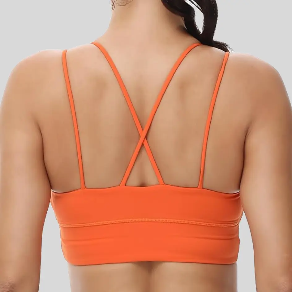 Strappy bras in orange, creating a warm and dynamic aesthetic.