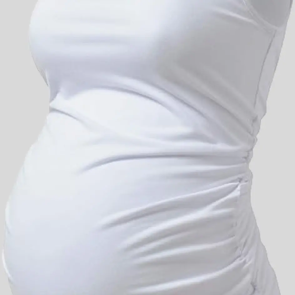 A maternity yoga outfit in white, featuring a clean, minimalist look with breathable and stretchable fabric.