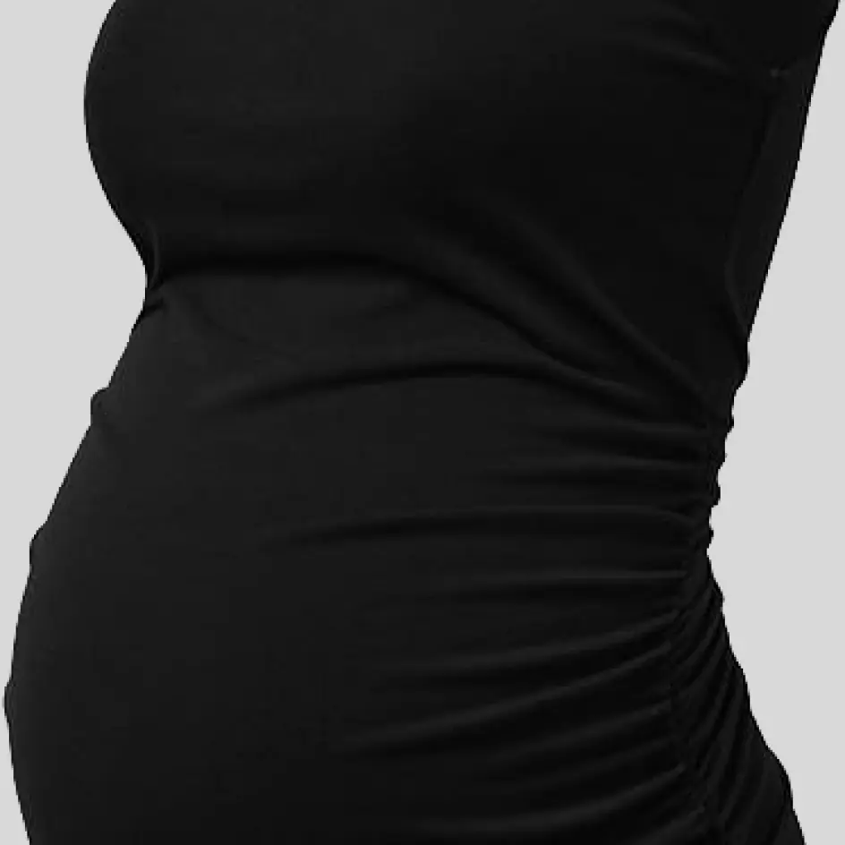 A maternity yoga set in black, offering a classic, slimming design with versatile styling options.