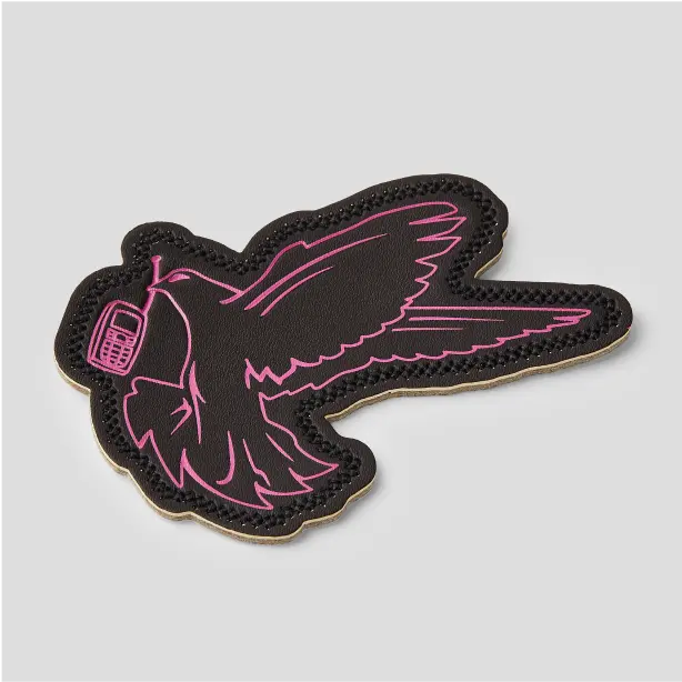 Custom leather patch with a unique design, perfect for adding a touch of individuality to your clothing and accessories.