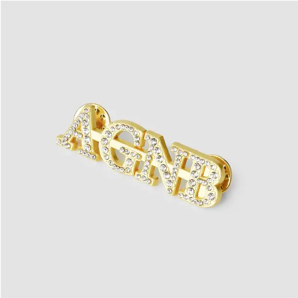 Custom text pins featuring personalized messages, perfect for gifts or events, adding a unique touch to any outfit.