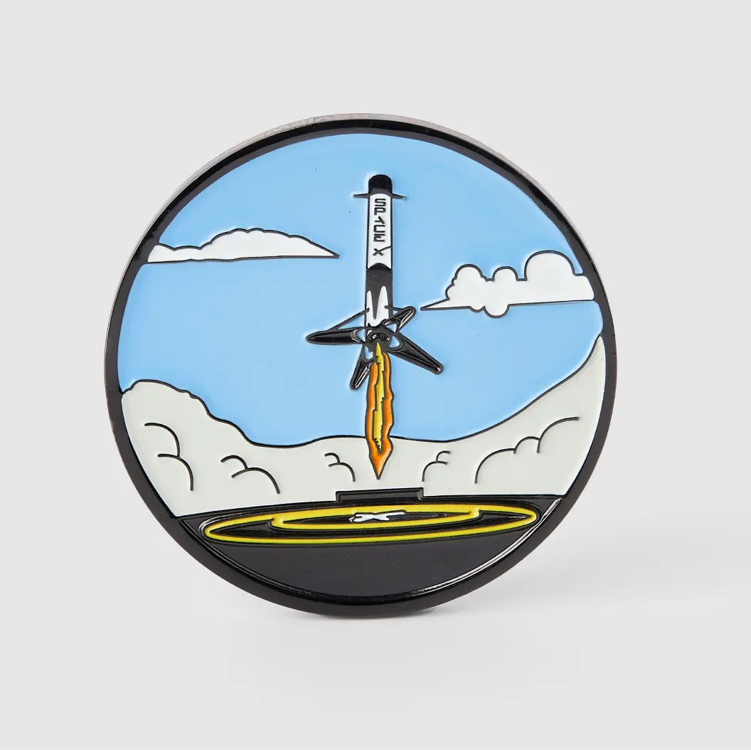 Custom coin featuring bright colors and a rocket taking off, symbolizing innovation and adventure.