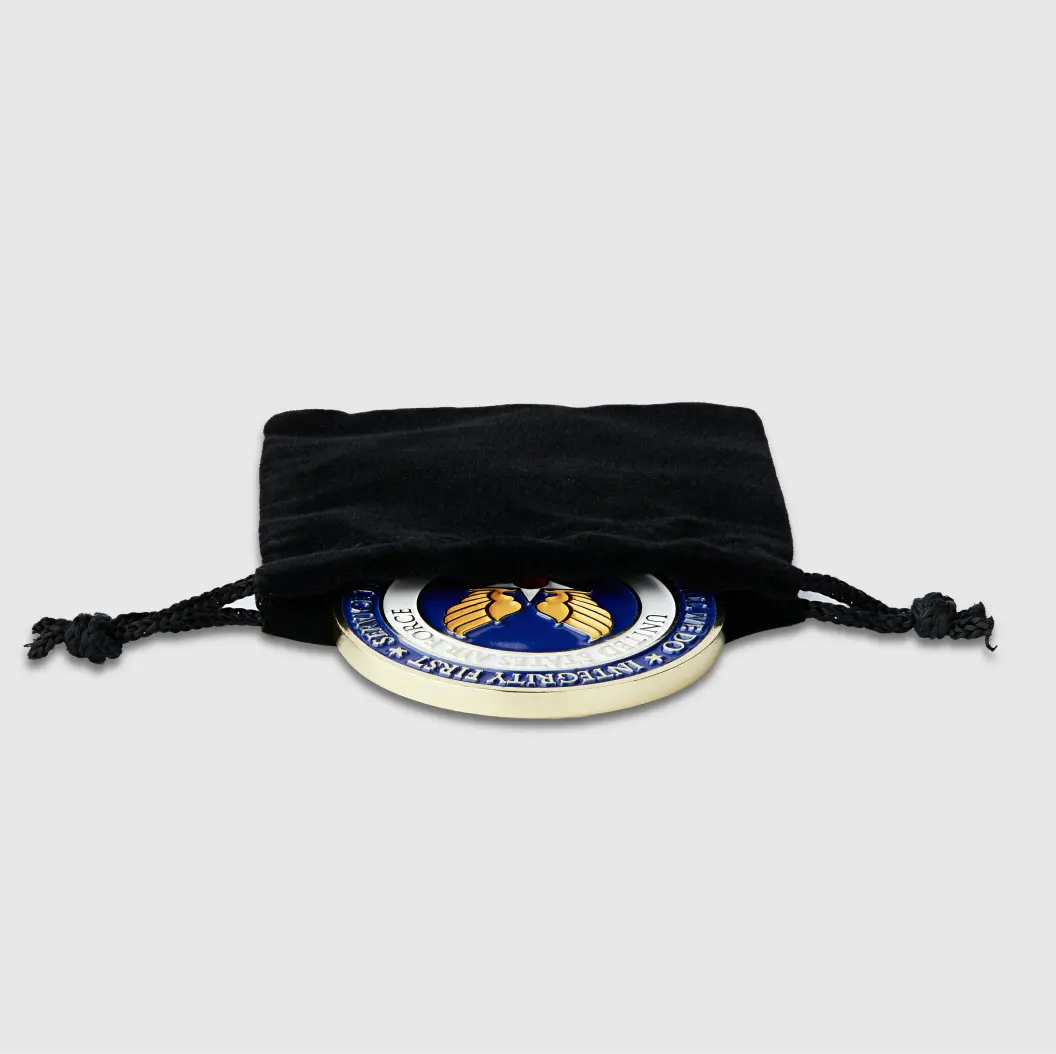 Custom medal nestled inside a black velvet pouch, showcasing a luxurious presentation.