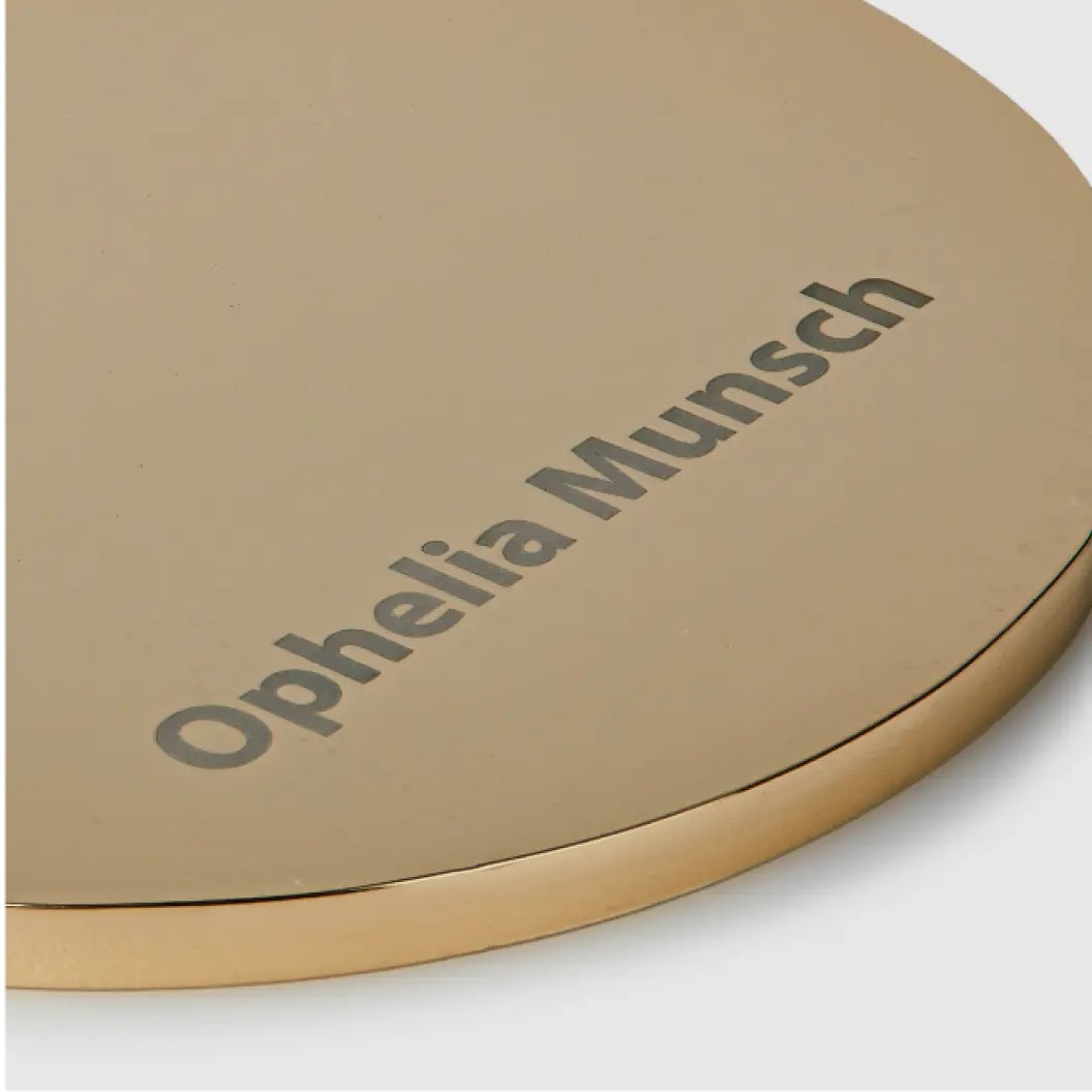 Gold medal engraved with the name “Ophelia Munsch.”