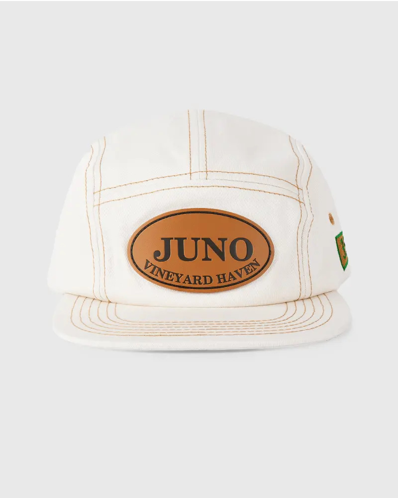 White cap with a leather patch and “JUNO Vineyard Haven” text.