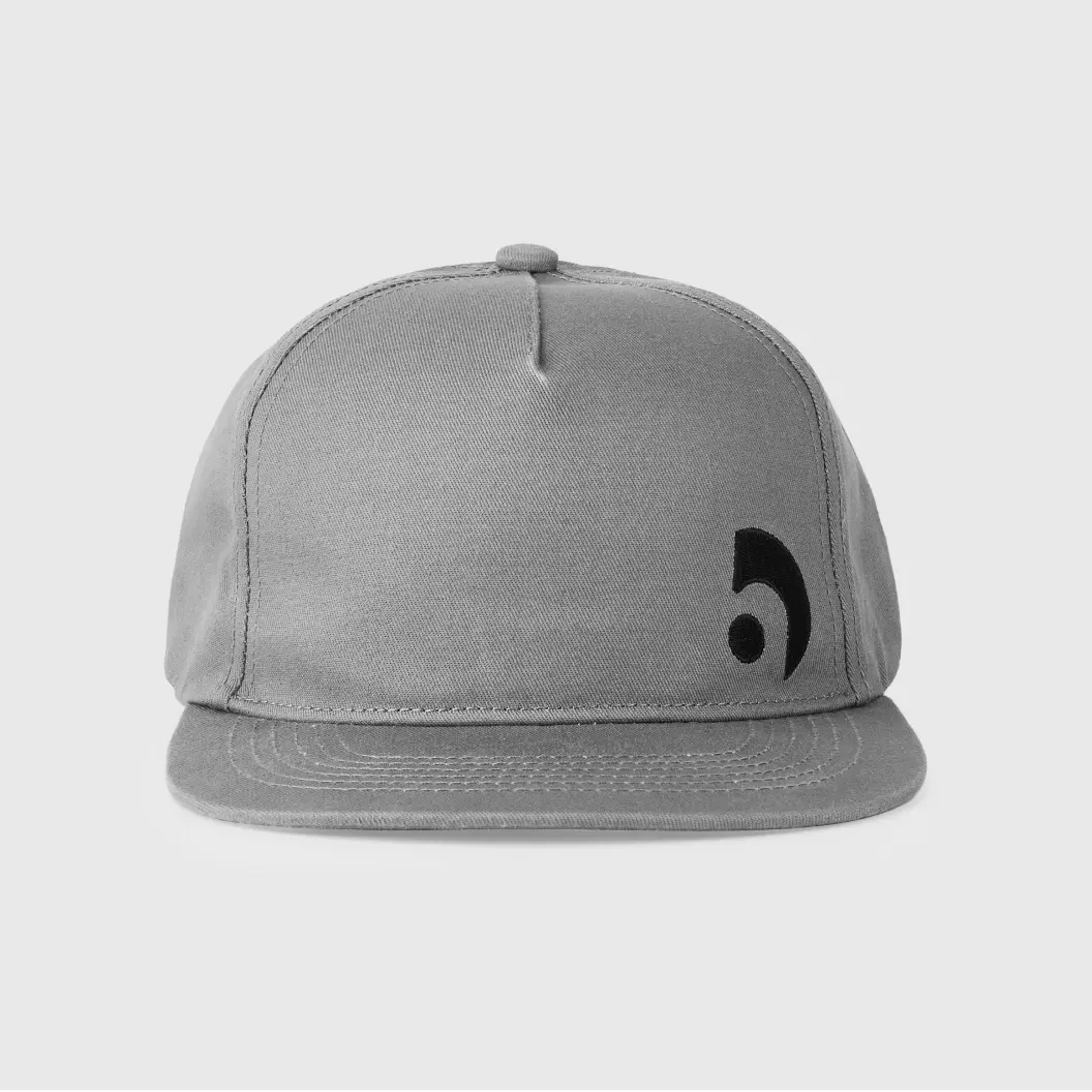 Gray flat-brim hat with small black embroidered logo on the left side of the front panel.