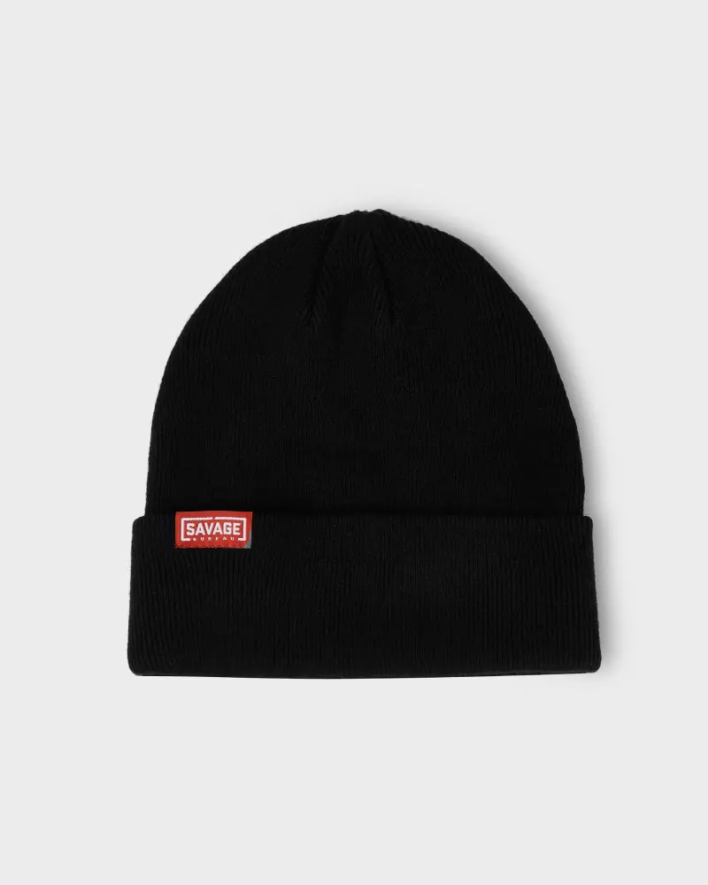 Black beanie with a small rectangular label.