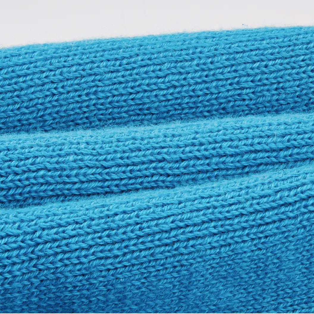 Close-up of a blue knitted beanie.