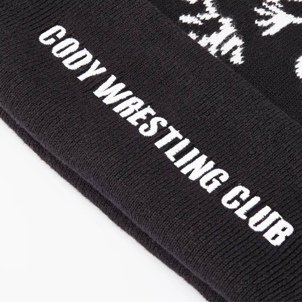 Black beanie with “Cody Wrestling Club” text and a small wrestler icon.