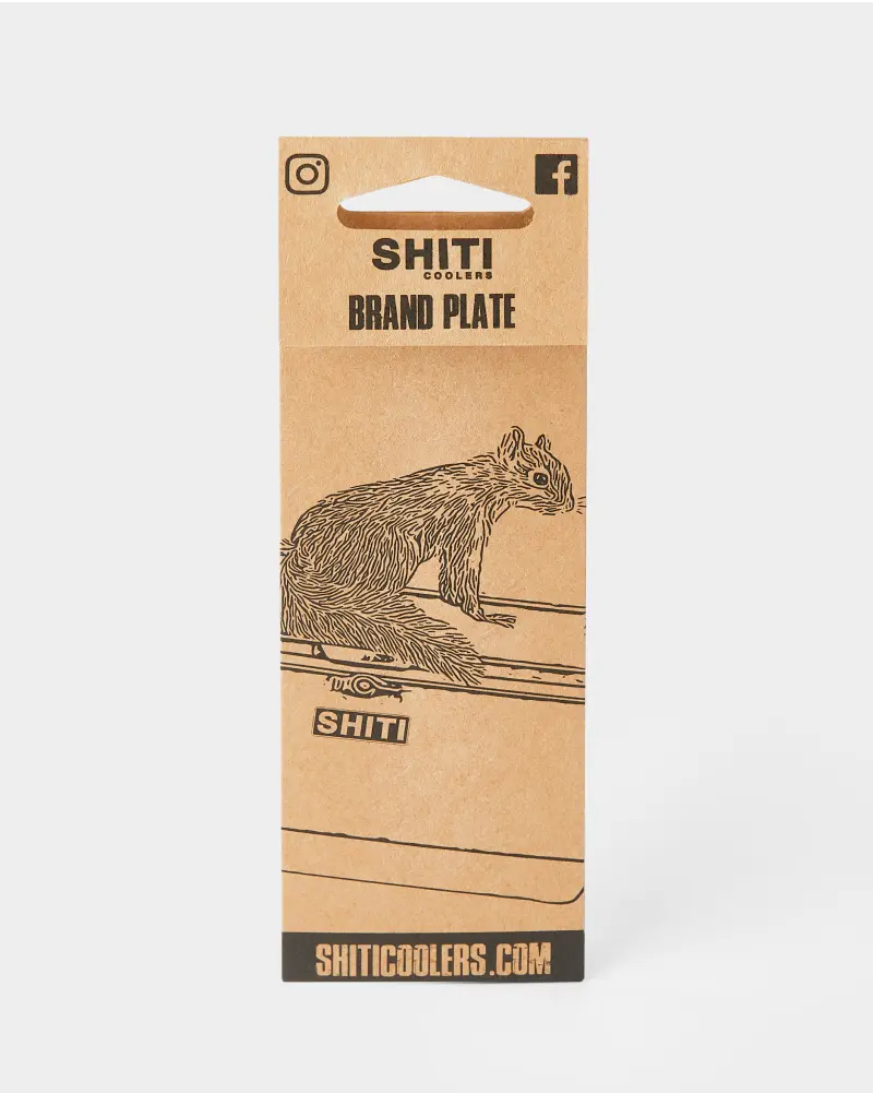 Natural brown kraft paper backer card featuring an illustration of a squirrel with “SHITI Coolers” branding and website information