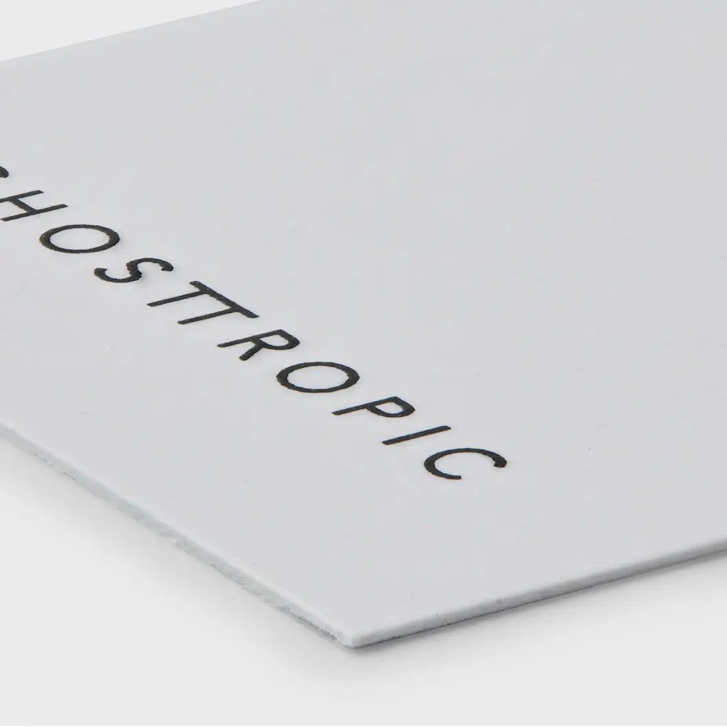 White hang tag with the word “Ghostropic” in black text.