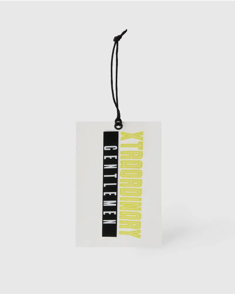 Vertical rectangular white hang tag with bold, contrasting black and yellow typography, featuring a black string.