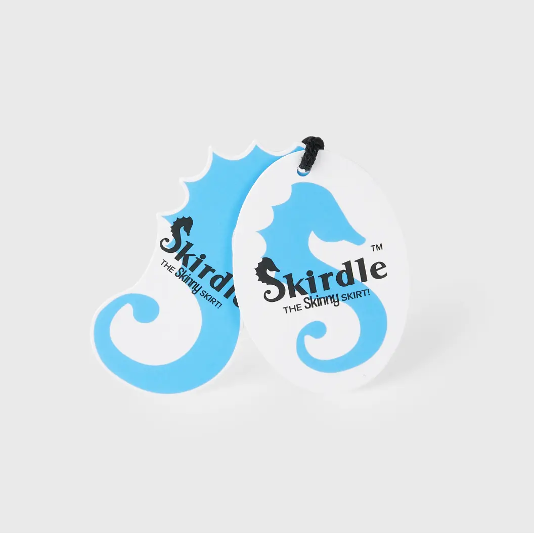 Two custom-shaped hang tags in blue and white, resembling seahorses, with “Skirdle” branding.