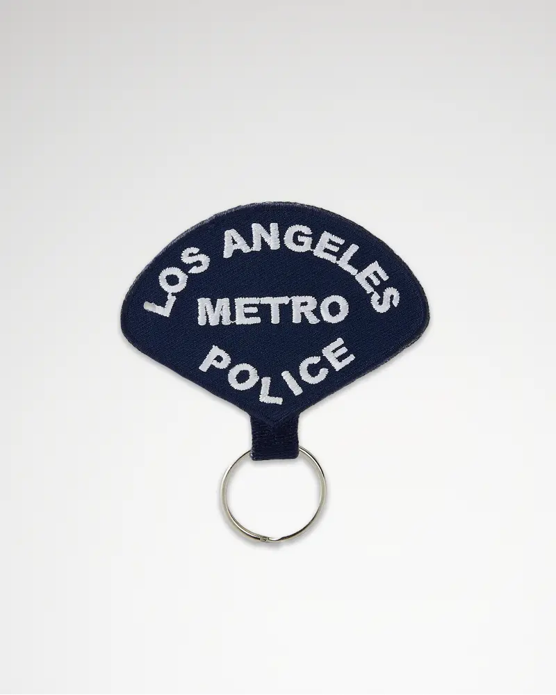 Dark blue embroidered keychain with white text reading ‘Los Angeles Metro Police.’