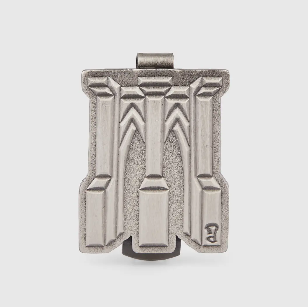 Silver pin featuring a detailed binocular design.