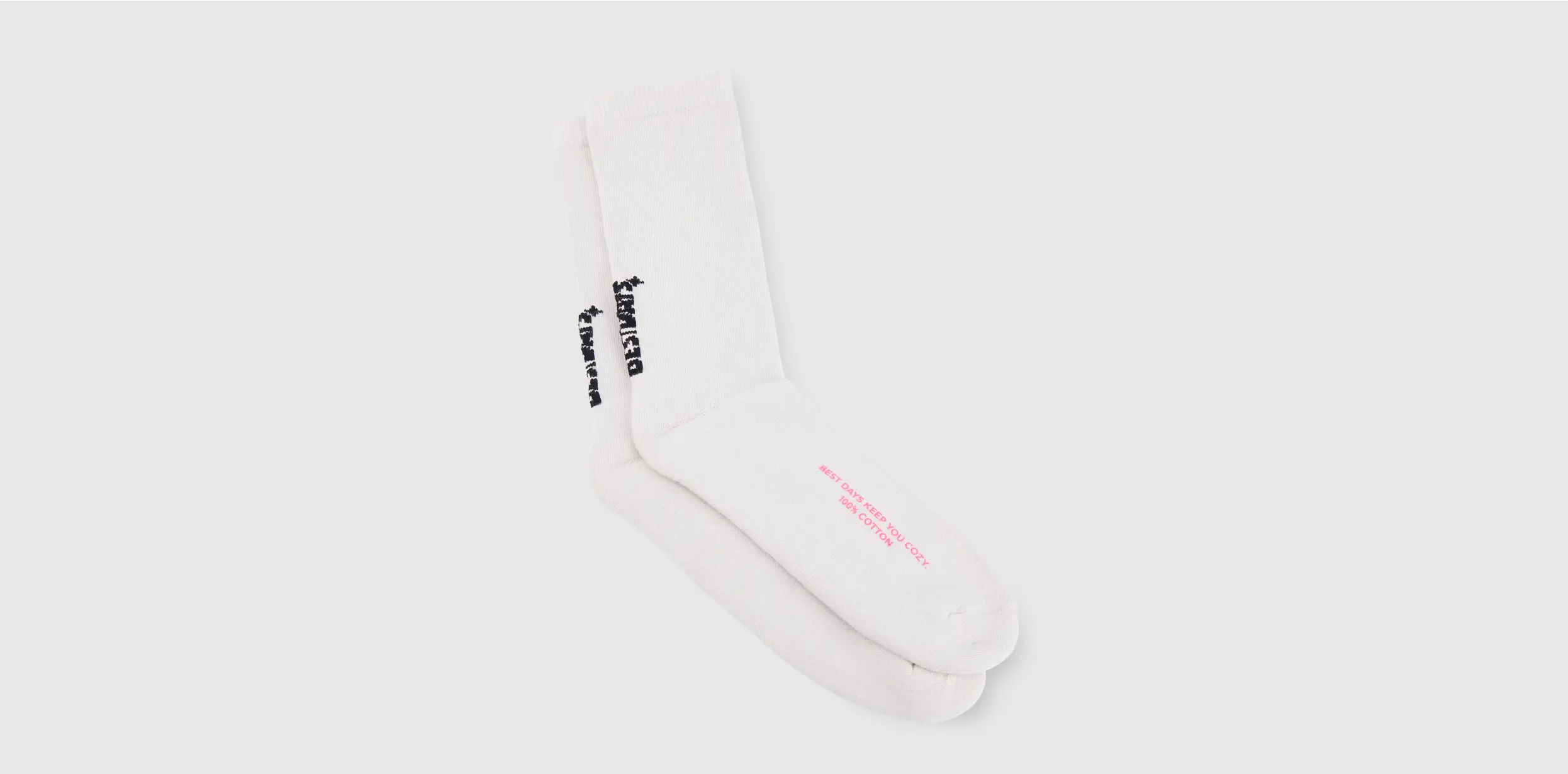 Custom white socks with black and pink lettering.