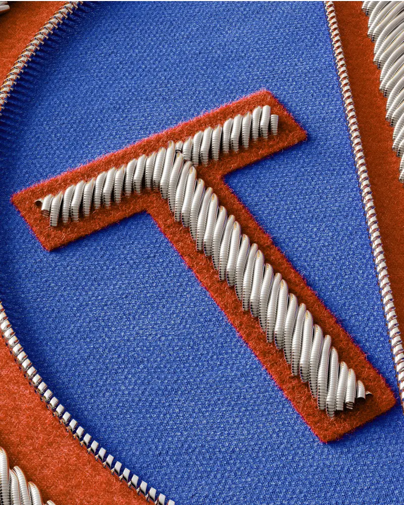 Close-up of a color appliqué bullion patch, showcasing vibrant fabrics and detailed metallic stitching.