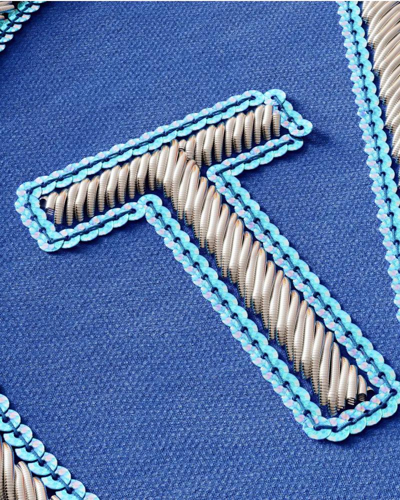 Close-up of sequins bullion patch, highlighting shimmering sequins and intricate stitching details.