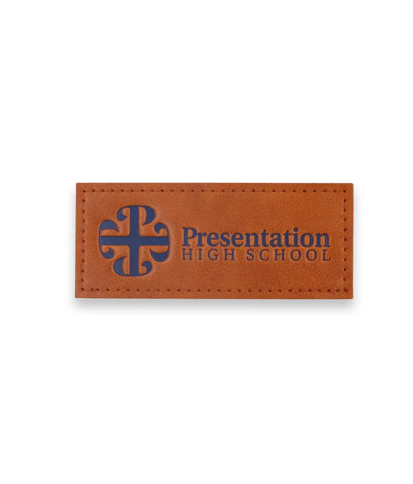 Rectangular brown leather patch with sophisticated blue logo and “Presentation High School” text.