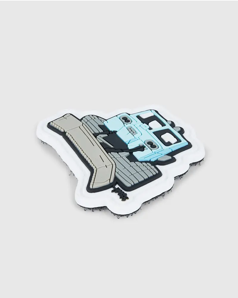 Custom PVC patch in the shape of a blue and grey bulldozer.