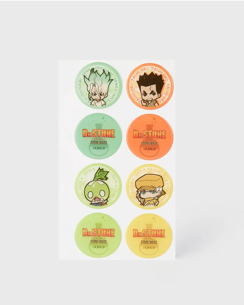 Colorful sticker sheet featuring characters and logos from the Dr. Stone anime, with round stickers in green, orange, and yellow.