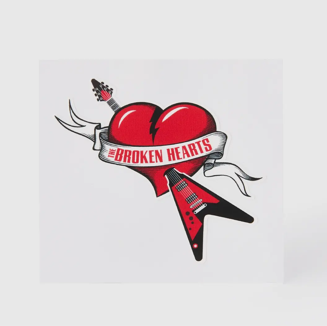 Sticker featuring a broken heart design with guitars, promoting 'The Broken Hearts' music band.