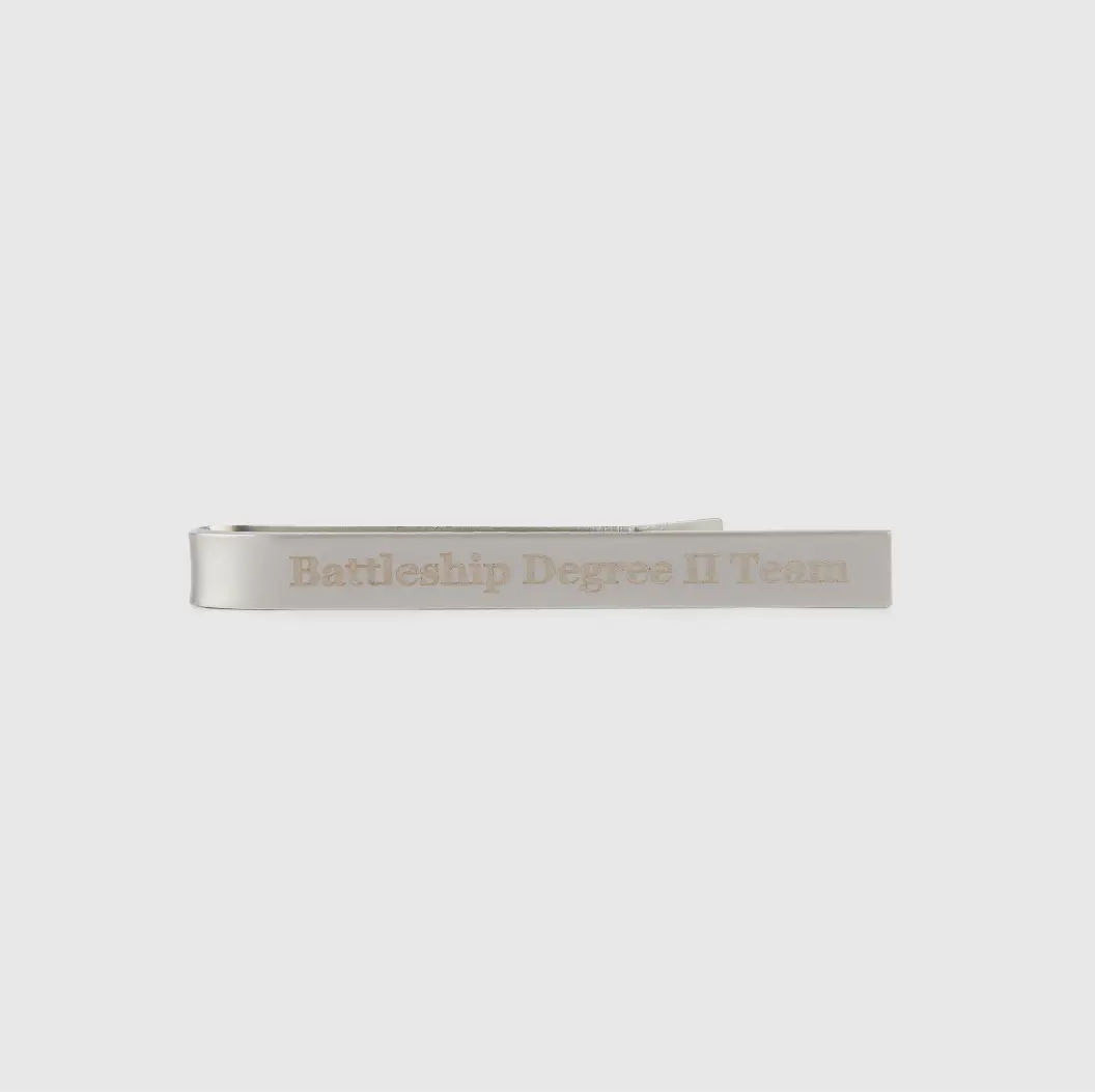 Simple silver tie bar engraved with 'Battleship Degree II Team' in clean, elegant font.