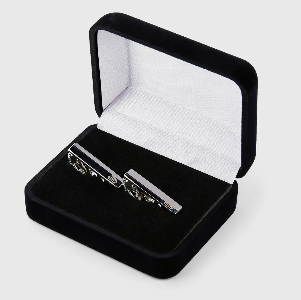 Elegant tie bar presented in a luxurious velvet box, perfect for gifting and showcasing style.